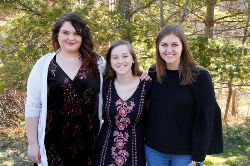 three women standing