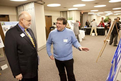 CLAS Dean Fred Antczak chats with John Capodilupo, professor of Biomedical Sciences, at a previous Showcase