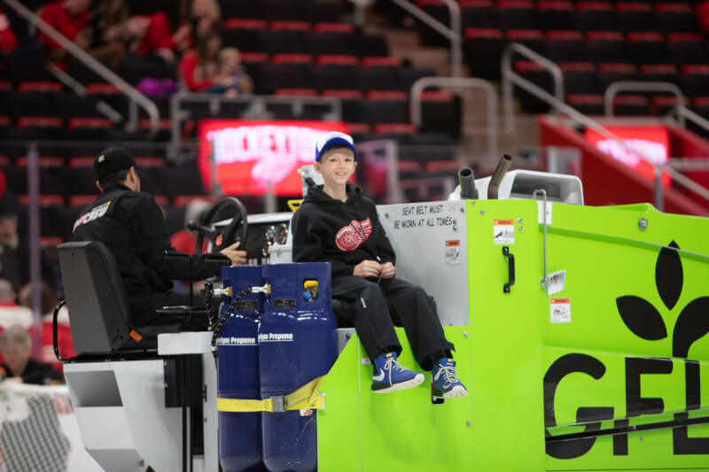 Cooper Maas, son of alumna Sarah Maas, '04, received the special experience of riding a Zamboni during the game.