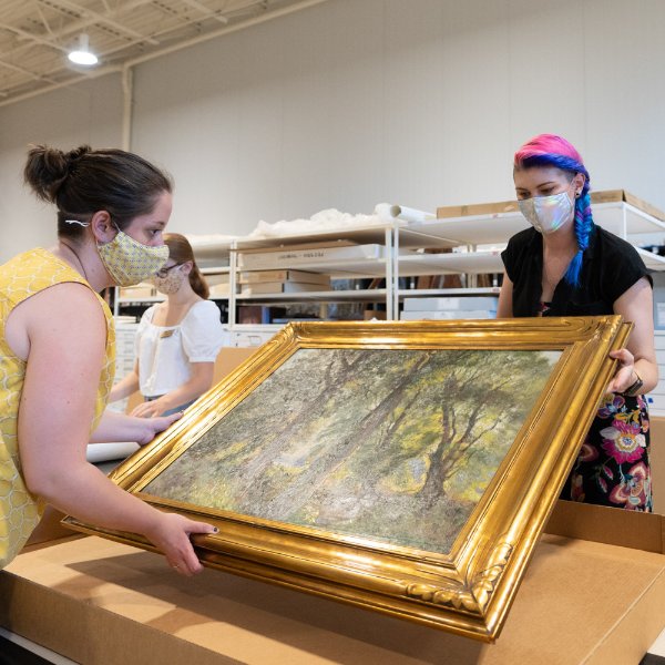 Workers pack a Mathias Alten painting.