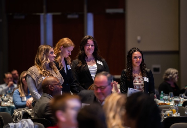 GVSU Seidman College of Business students stand for recognition during the Economic Outlook presentation at the Grand Rapids Chamber of Commerce Annual Meeting.