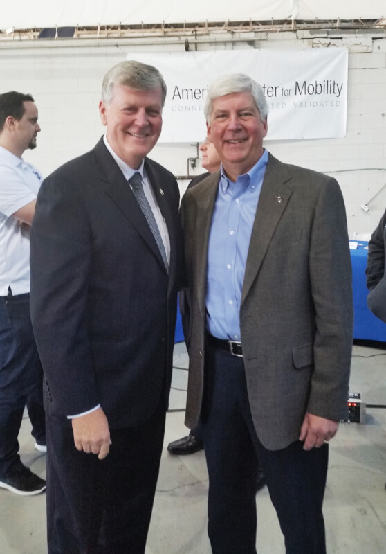 A photo of Haas with Gov. Rick Snyder.
