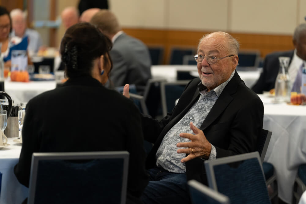 Peter F. Secchia talks with President Philomena V. Mantella.