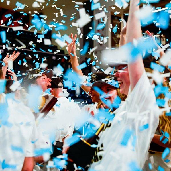 GVSU Women's Basketball Team celebrates with confetti raining down on them.