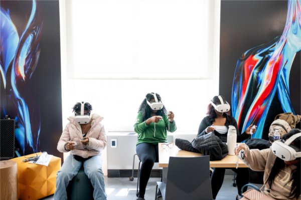 Charter school students wear VR headsets. 