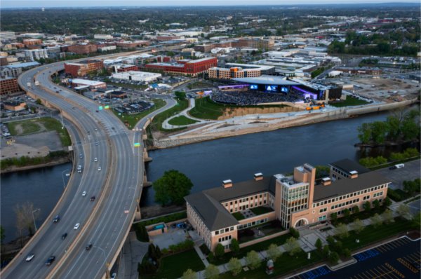  A drone photo showing a new amphitheater, a river and a cityscape. 