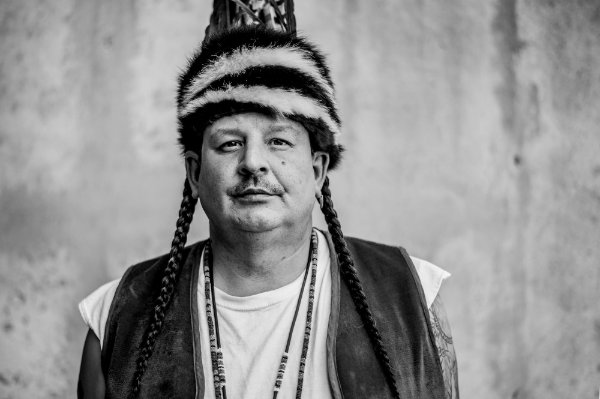  A portrait of an indigenous person at a Pow wow. 