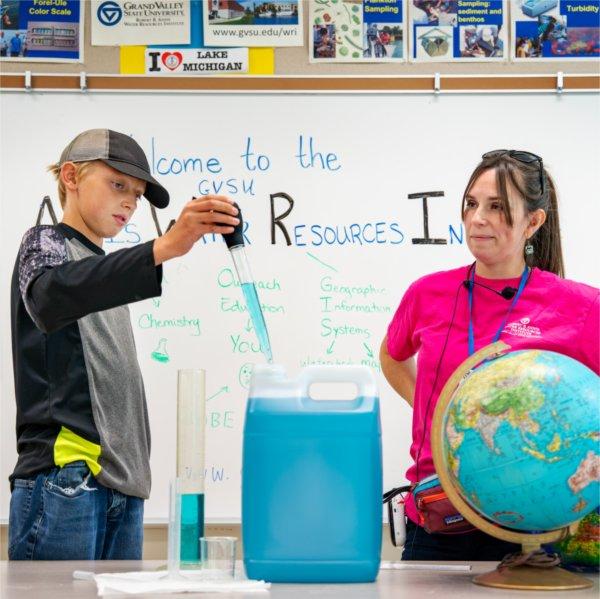 A.J. Bacon, a Crossroads Charter Academy student from Big Rapids, takes part in an educational visit to the Annis Water Resources Institute in Muskegon with AWRI science instructor Brittany Sweezer.