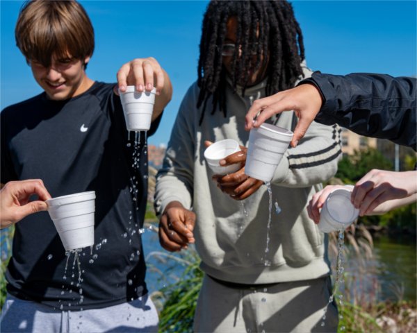 Crossroads Charter Academy students from Big Rapids, including Aiden Smith, left, and Jerome Nelson take part in a hands-on watershed simulation as part of an educational visit to the Annis Water Resources Institute.