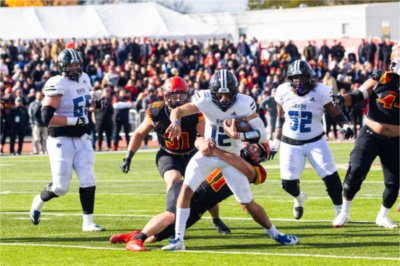 Grand Valley quarterback Brady Drogosh fights through a tackle during the Anchor-Bone Classic at Top Taggart Field in Big Rapids, Michigan, on Oct. 25, 2025.