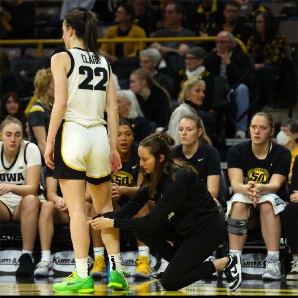 Andrea Chilcote tending to Caitlin Clark