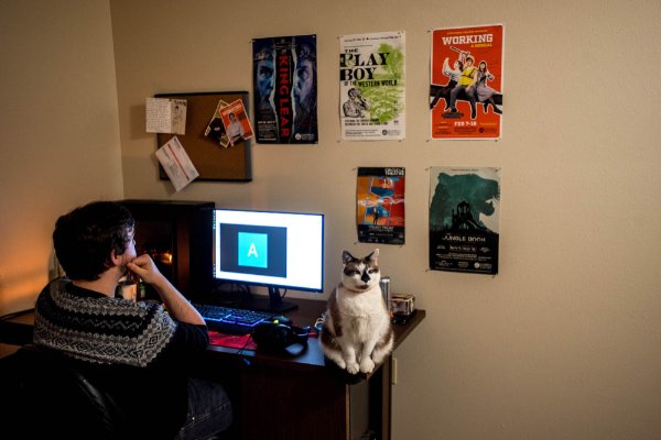 Alex Coy with his cat, Diana