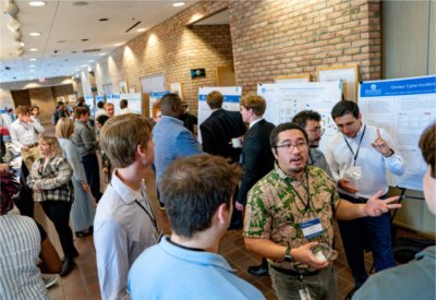 Paliku'i Grant, right, of the Gentex Corporation, speaks with students during the College of Computing Innovation Day: Computing + X at the Eberhard Center on April 24.