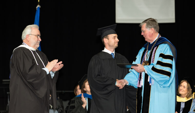 The Grand Valley Alumni Association presented the Young Alumni Award to Cory Jackson, nutrition and wellness director for YMCA of Western North Carolina.