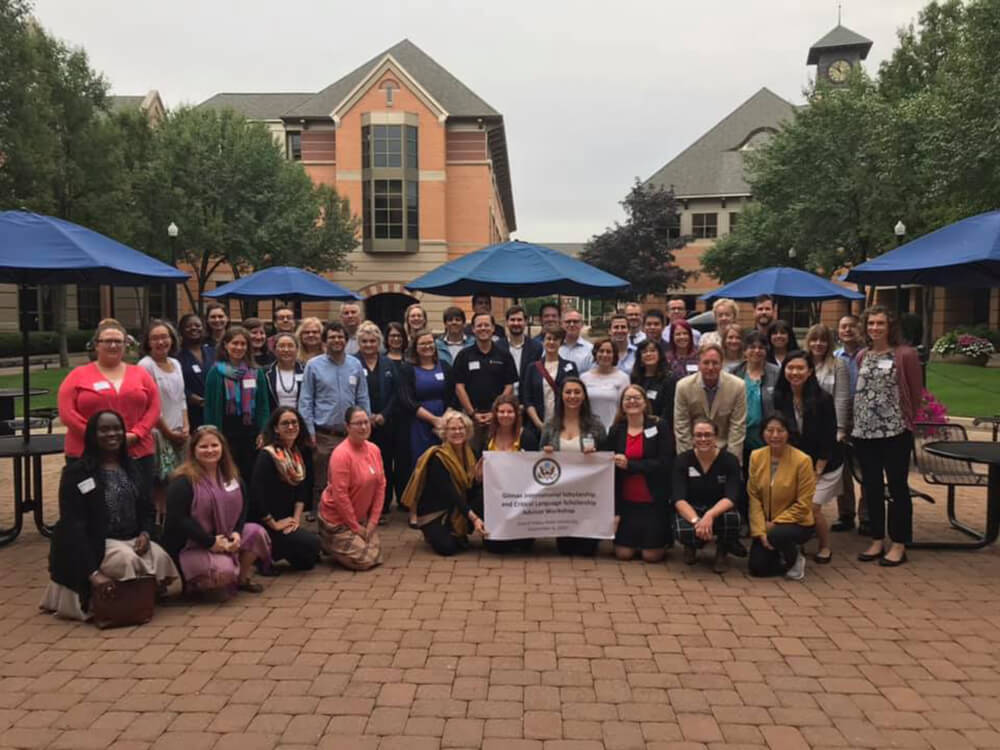 A group of people who took part in the Gilman/CLS scholarship workshop post in the DeVos Center Courtyard for a group photo.