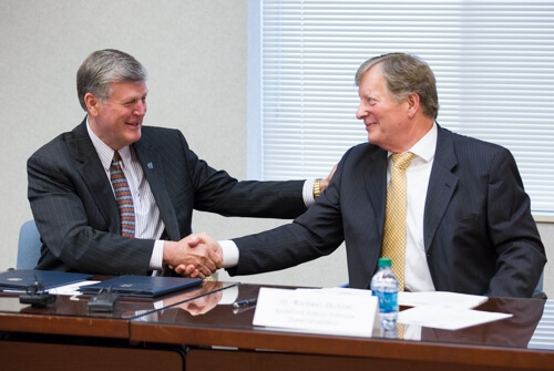 President Thomas J. Haas, left, and Michael Shibler, superintendent for Rockford Public Schools, signed the early college program agreement in April 2016.