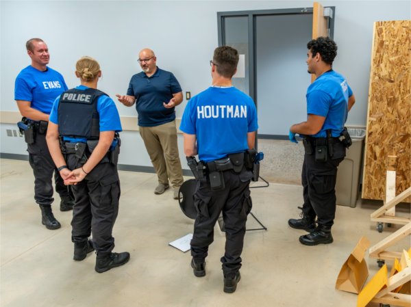 Gary Lathan speaks with recruits during forensic training