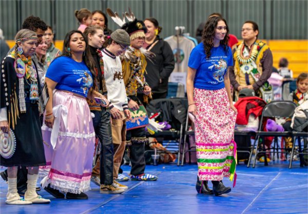 Current and former GVSU students, including Native American Student Association president Kella Elswick, far right, and NASA vice president Saviee Zavala-Perez, second from left, take part in a dance during the Pow Wow.