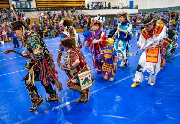 Dancers take part in the Grand Entrance to begin the Pow Wow.