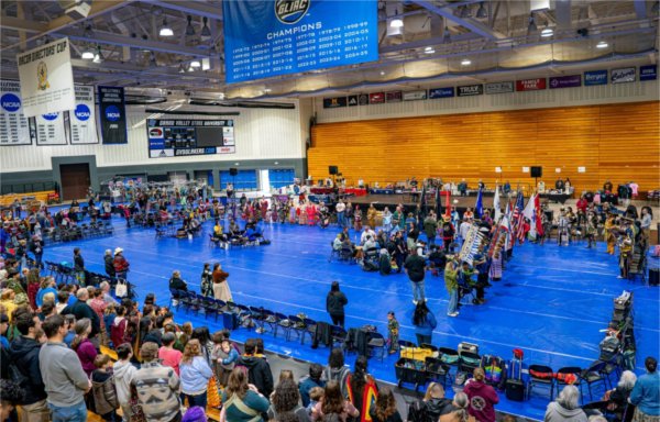A crowd takes part in the All Walks of Life Traditional Powwow at the Fieldhouse on April 4.