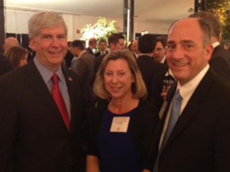 Snyder (left) and Beasley (middle) pose for a snapshot at a reception in Germany.
