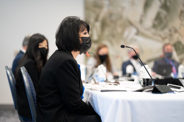 President Philomena V. Mantella, wearing a mask, looks on at the Board of Trustees meeting.