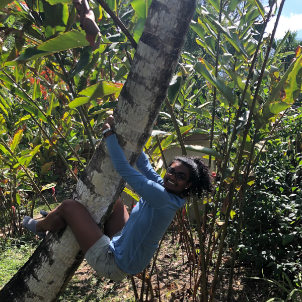 Christa Fernando grabs a tree in Belize.
