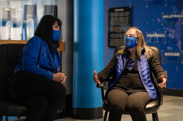 President Mantella and Joan Boand seated and talking