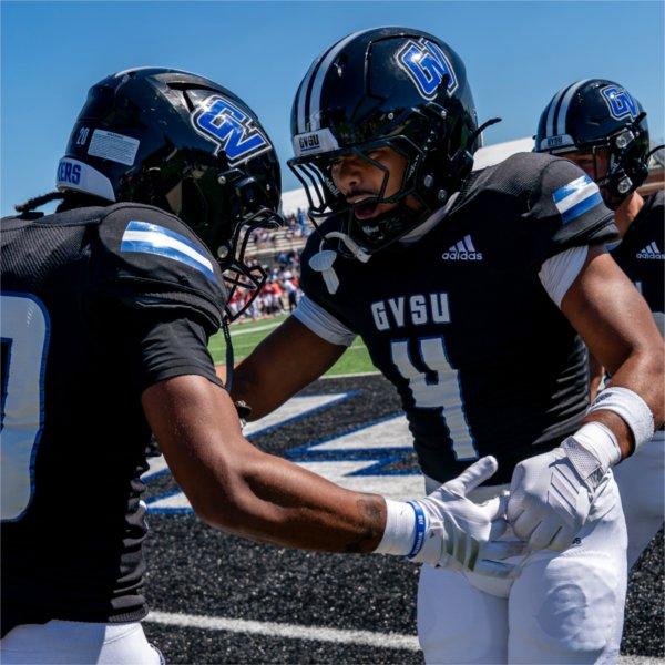 Grand Valley football players warm up before a game.