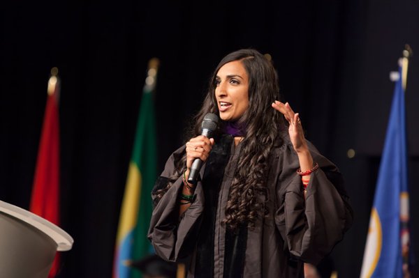 Valarie Kaur speaks with a microphone