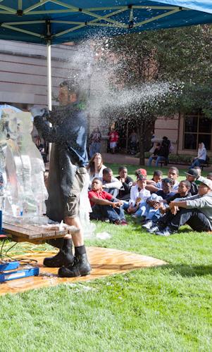 Derek Maxfield demonstrates ice carving for Grand Valley charter school students.