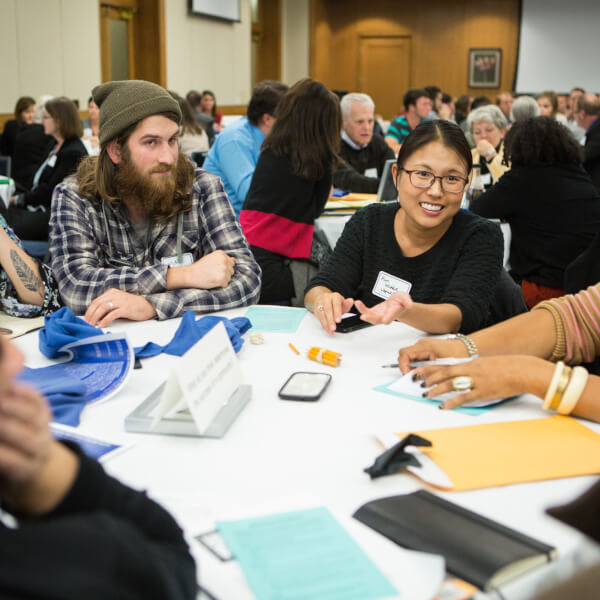 group of people talking around a table