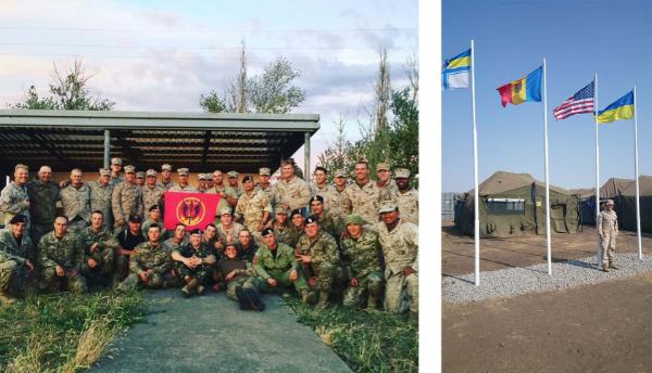 A group of military personnel, wearing fatigues, to the left. To the right, a U.S. military member stands near several flagpoles.