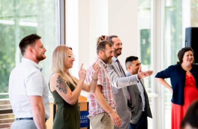 A panel, pictured from left, Devin Daniels, Sarah Anderson, Jeff Baldwin, Jay McBride and Travis Snyder talk with fellow veterans during a GVSU Laker Veterans luncheon where a Veteran Mental Health Project was discussed. 