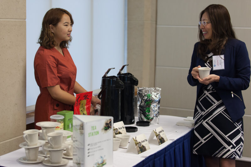 Ruixuan Ran, a senior from China who is majoring in accounting and international business, hosted a tea table for area business leaders who are learning best practices for doing business abroad.