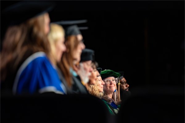 Members of the Senior Leadership Team, including Jenny Hall-Jones, vice president for Student Affairs, take part in the afternoon Commencement ceremony at Van Andel Arena on May 2.
