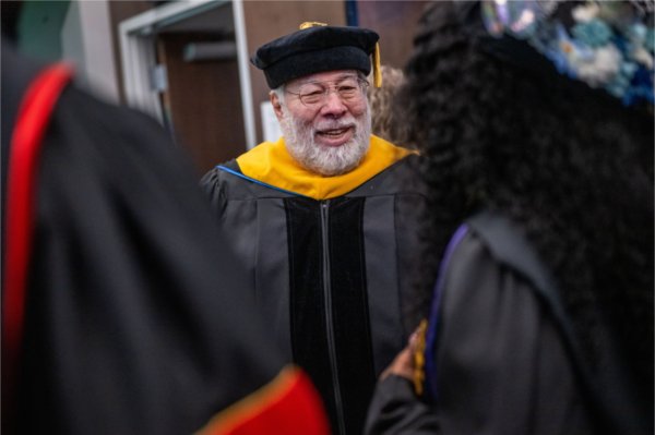 Apple co-founder Steve Wozniak, center, talks with Student Commencement speaker, Elaina Marcum, right, before Wozniak gave the Commencement Address at Van Andel Arena on May 2.