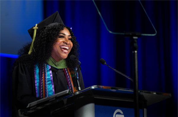 Student Commencement speaker Elaina Marcum addresses the crowd. Marcum graduated with a master&#8217;s degree in recreational therapy.