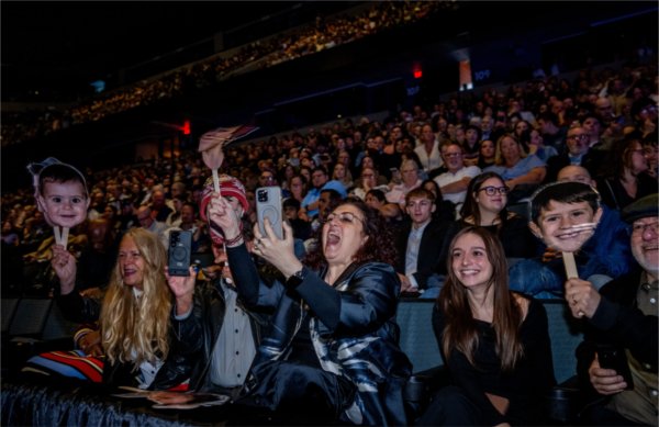 Business and marketing graduate Liam Boppel&#8217;s family, including his mother, center, erupts in cheer as Boppel crosses the stage during the Saturday morning Commencement May 2. 