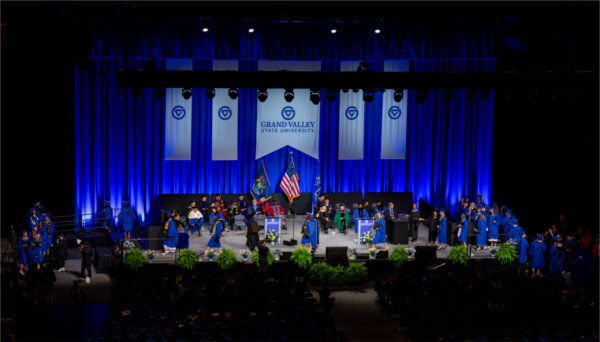 Graduates react walk past the stage after receiving their diplomas during the Commencement ceremony at Van Andel Arena on May 1.