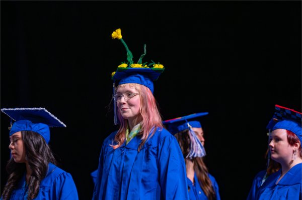 Graduates wait their turn to walk past the stage after receiveing their diplomas during the afternoon Commencement ceremony at Van Andel Arena on May 2.
