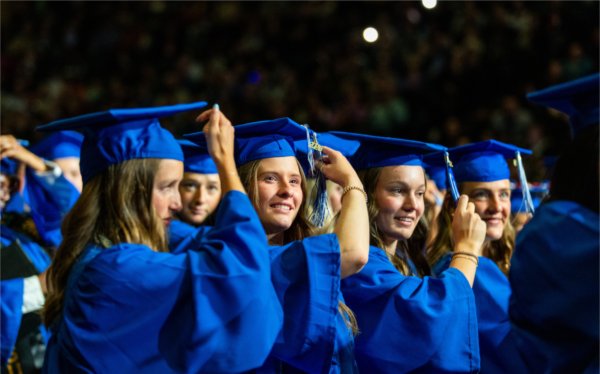 From left, Reagan, Emmalyn, Ally and Aliana, all education graduates, turn their tassels during Grand Valley State University&#8217;s spring commencement at Van Andel Arena on May 1, 2026.