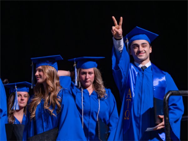 Graduates wait their turn to walk past the stage after receiveing their diplomas during the afternoon Commencement ceremony at Van Andel Arena on May 2.
