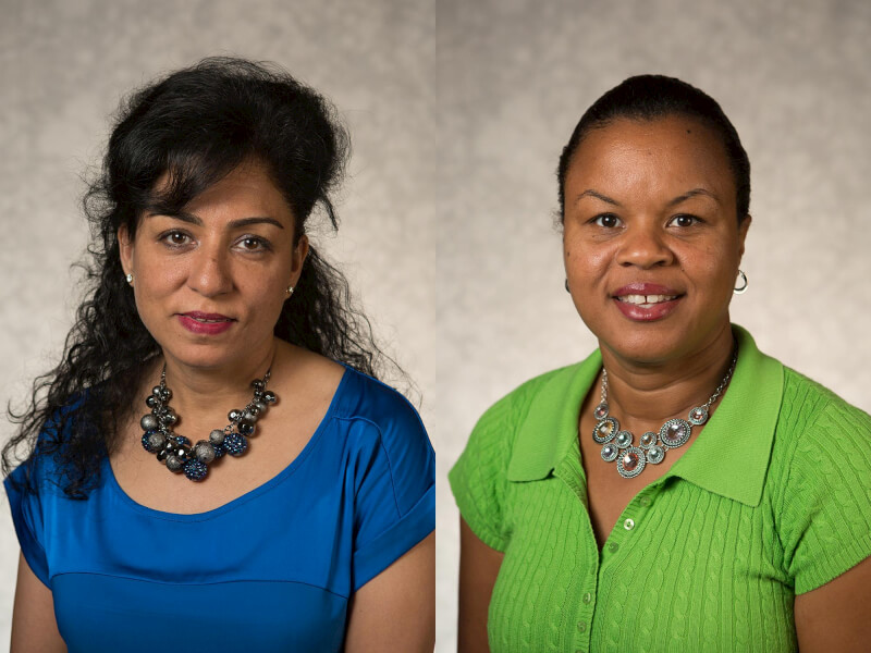 Economics professors Sonia Dalmia, right, and Claudia Smith Kelly