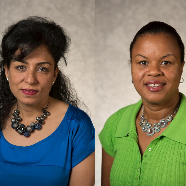 Economics professors Sonia Dalmia, right, and Claudia Smith Kelly