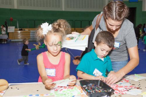 Student parents and their families enjoy Family Fun Night at the Fieldhouse.