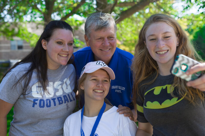 President Thomas J. Haas with students.