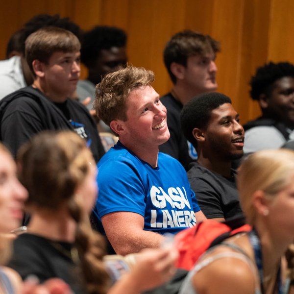 Student athletes listen to a lecture