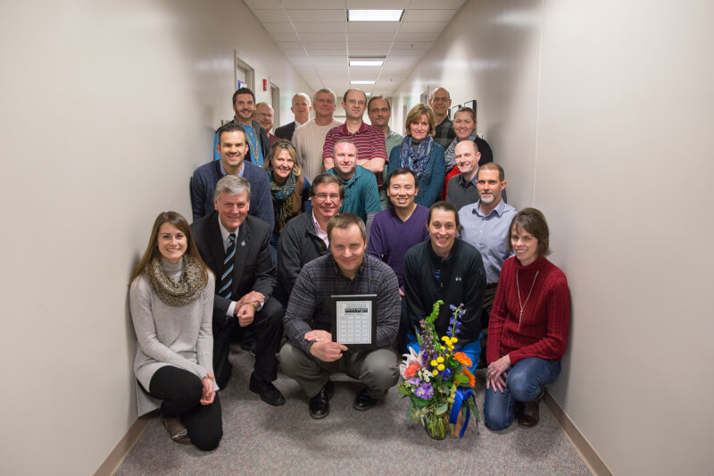 group of people standing, kneeling