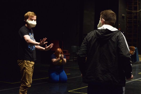 Cast members rehearse a scene from "Ernest Maltravers."